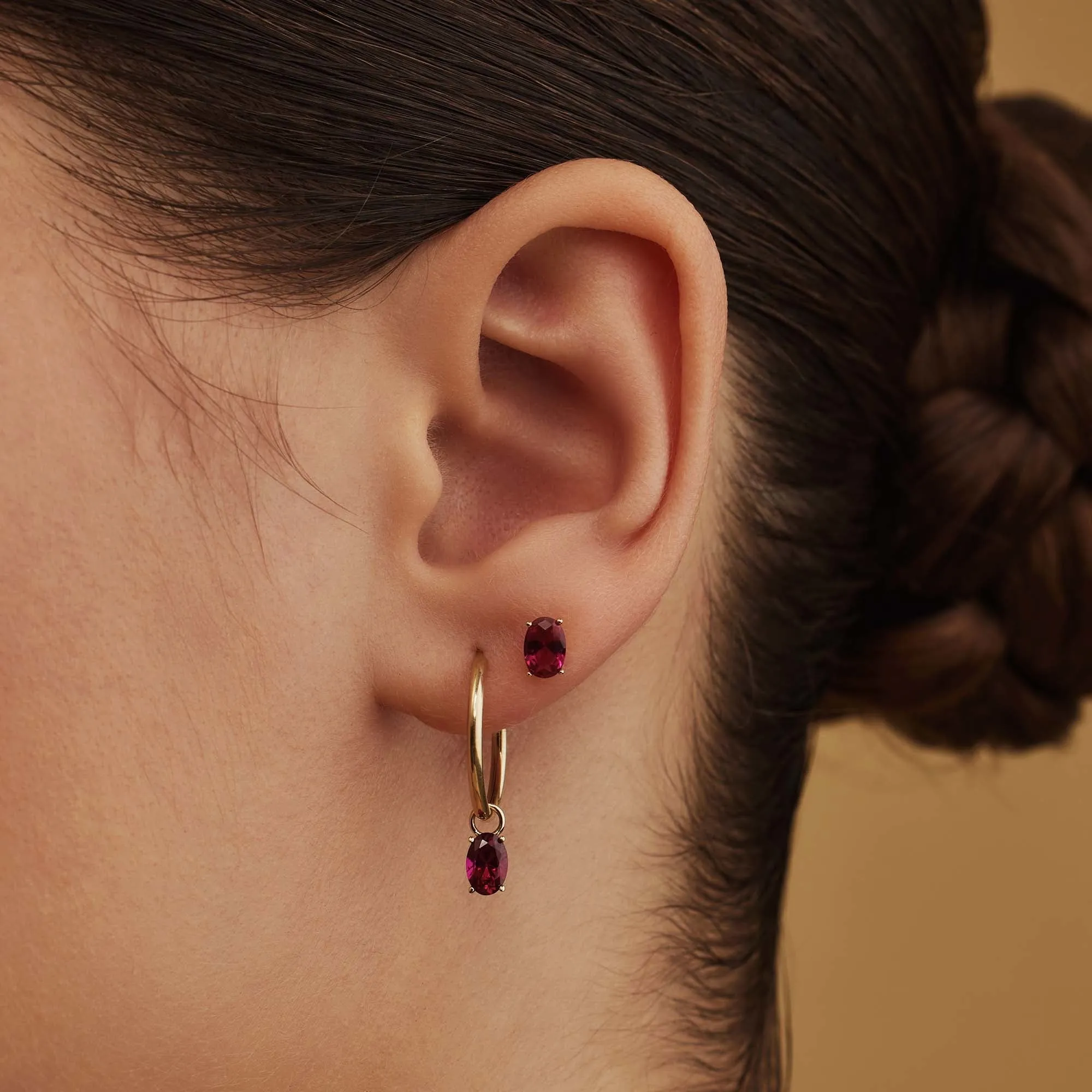 Baguette Roux 14 karat gold stud ear studs with red zirconia stone